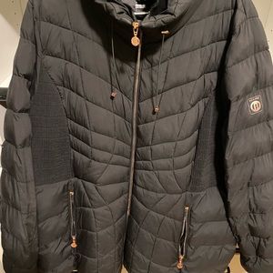 Black Puffer Jacket with Cinched Waist Detail and Carrying Bag